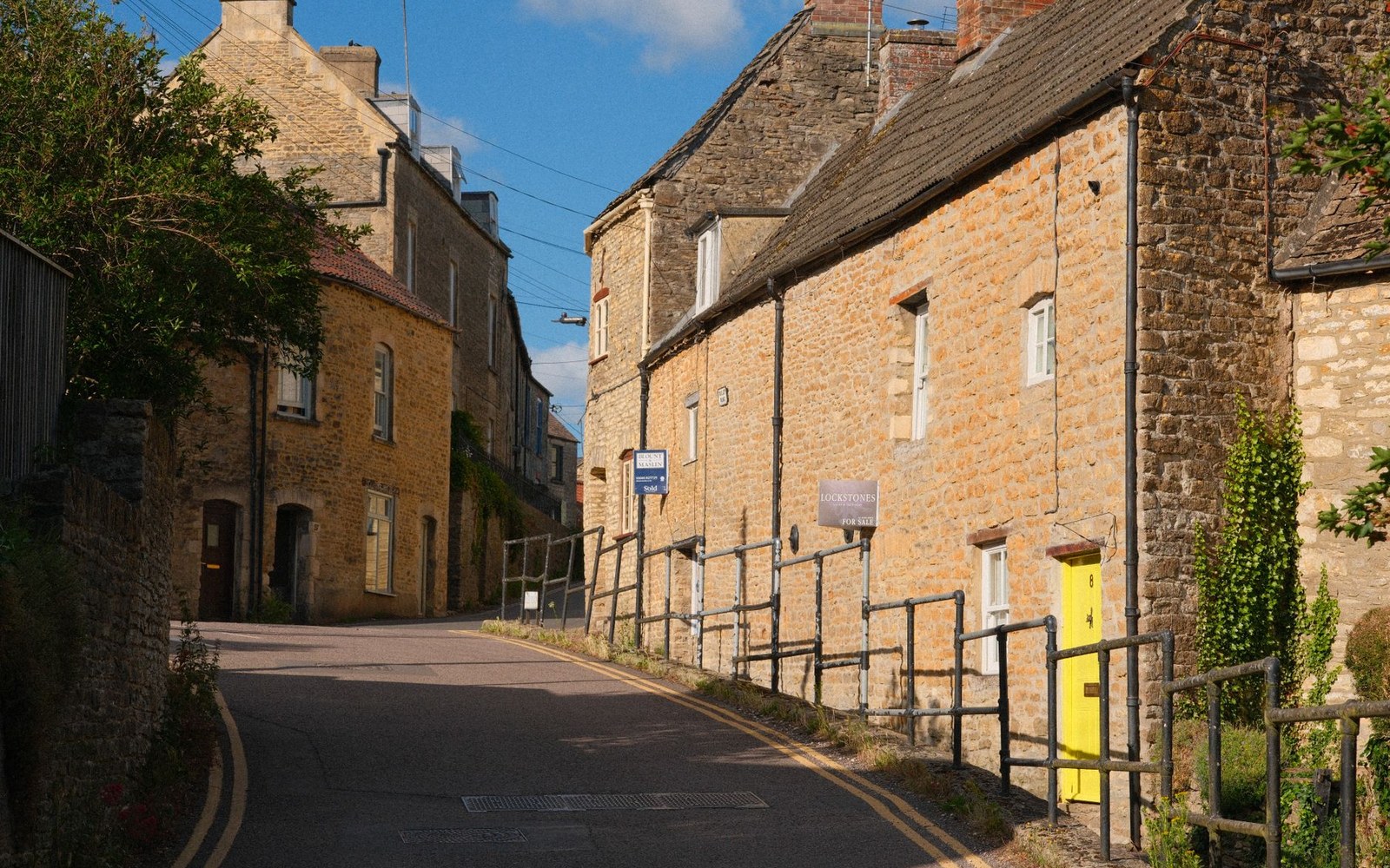 a narrow cobbled lane between stone walls